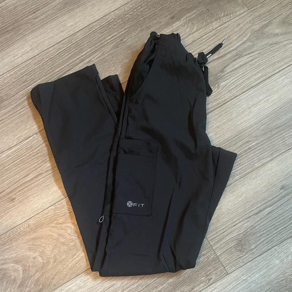 Assorted scrub pants and tops